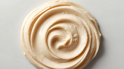 The product photography features a close-up of a smooth beige cream spread with soft ridges and texture, showcasing its minimal and realistic style.