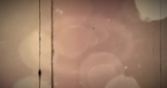 Vintage film texture with light leaks and scratches creating an old movie effect - Powered by Adobe