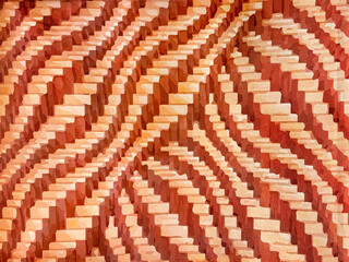 Close up of red and white pink abstract curvy weaving illustration printed on wallpaper. Suitable for wall covering, graphic background. For interior finishes. Seamless background texture.