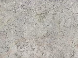 Decorative white textured paint on a wall or panel. White washed paint with random brush strokes, grunge, and dirt pattern. Seamless background texture.
