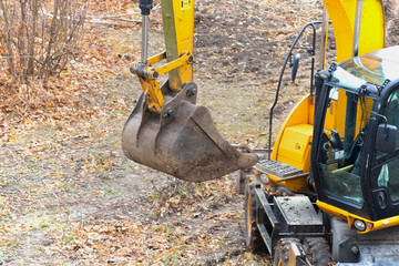 Close-up of the boom and bucket of an excavator on a construction site