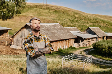 Handsome farmer embraces rural life in picturesque countryside setting