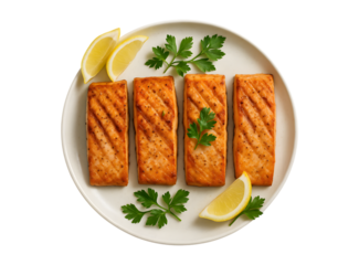 Grilled salmon fillets garnished with lemon and parsley on a white plate