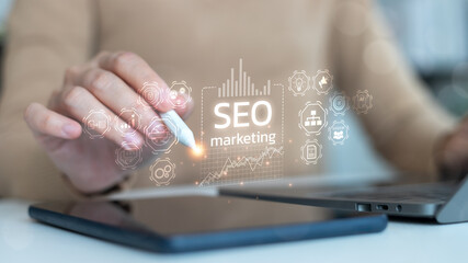 Businesswoman using stylus with SEO marketing interface, digital analytics and data strategy concept, modern business technology.