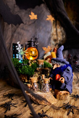 A postcard with a smiling Halloween beldam in a clearing in a cobwebby dark forest on Halloween...
