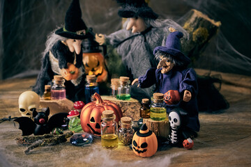 three witches gather on Halloween evening to perform witchcraft on All Saints Day in a dark...