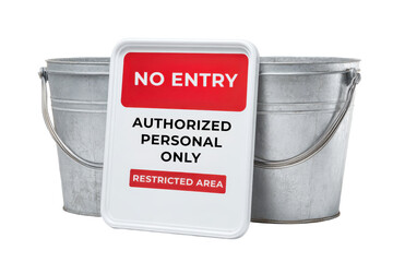 A metal sign reading "NO ENTRY" hangs in front of two metal buckets, indicating access restrictions for authorized personnel only.