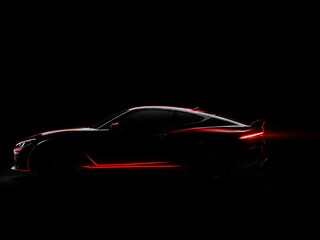 A realistic side view silhouette of a powerful, classic American muscle car against a solid black backdrop.