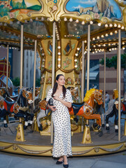 Stylish Woman Posing with Carousel