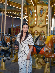 Close-up Stylish Woman Posing with Carousel