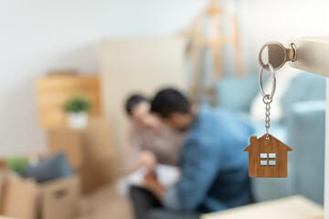 Moving house, relocation. The key was inserted into the door of the new house, inside the room was...