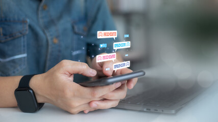 Close-up of hands typing on a smartphone with digital chat bubbles, symbolizing social media, online communication, and a mobile messaging app.
