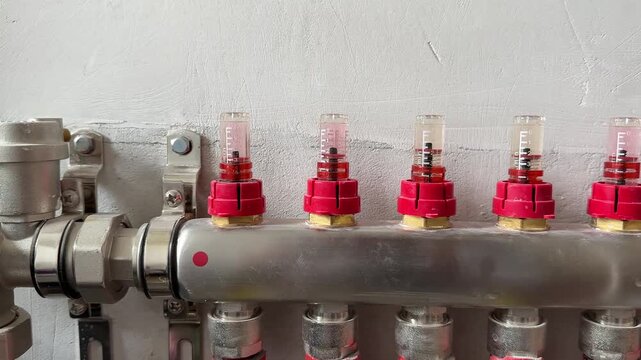 Water underfloor heating. Air valves closeup. Hinges of the water underfloor heating. Collector for underfloor heating