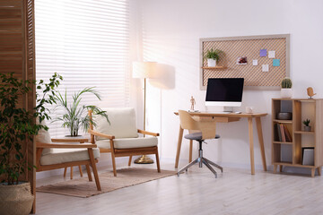 Stylish workplace with wooden desk and computer at home office. Interior design