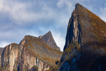Stunning autumn landscape of Segla Mountain in Senja Island, Northern Norway, with dramatic cliffs and fjords.