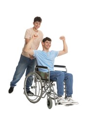 Happy young man in wheelchair and caregiver on white background