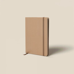 Minimalist beige notebook with elastic closure on a plain background