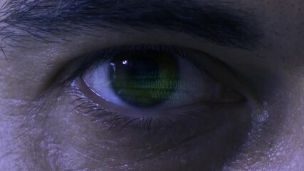 Conceptual video of Hacking and Digital Security reflected in an close-up Eye - Powered by Adobe