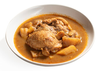 Thai tradition food : Massaman Curry is popular Thai food. Chicken curry with coconut milk, chili, and spicy herbs. Served with steam jasmine rice and fried egg. Isolated on white background. Close up