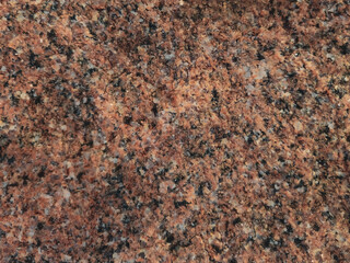 A granite pattern with pink, black and white blended specks background. Abstract full frame elegant...