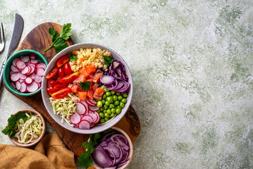 Balanced healthy bowl with vegetables and salmon