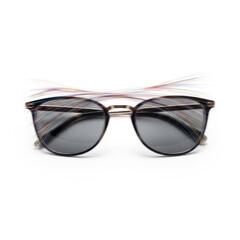 Stylish round sunglasses with colorful striped temples isolated on white background