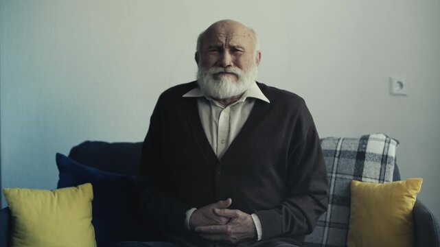 Portrait of elderly man suffering severe abdominal pain, pancreatitis symptoms