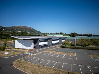 Contemporary industrial business park with commercial warehouses, logistics distribution hub,...