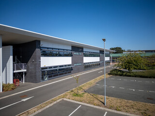 Contemporary industrial business park with commercial warehouses, logistics distribution hub,...