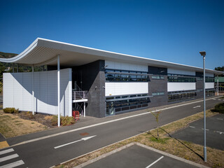 Contemporary industrial business park with commercial warehouses, logistics distribution hub,...