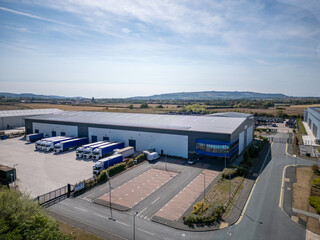 Spacious warehouse and logistics facility within a modern industrial park and trading estate, combining business park offices, storage distribution hubs and commercial property units