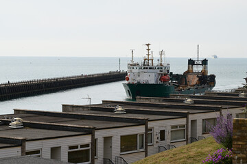 Cargo ship entering Newhaven Port. 