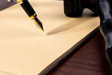 Classic legal background featuring a fountain pen resting on blank paper, representing...