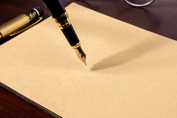 Classic legal background featuring a fountain pen resting on blank paper, representing...