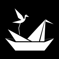 White origami crane bird on paper boat sailing