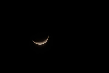 Solitary Crescent Moon Against a Pitch-Black Night Sky