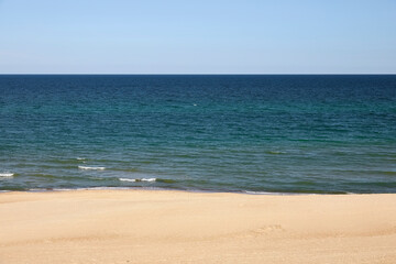 Blue sky, Baltic Sea, and a sandy beach in Mielno, Poland