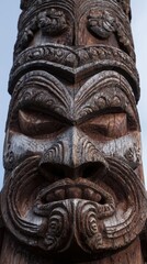 Wood carving of a tribal figure in nature