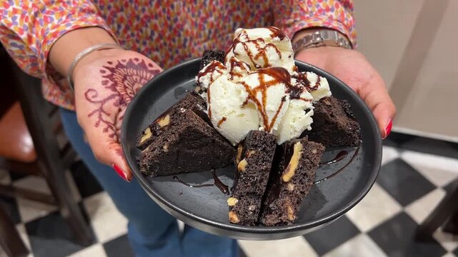 Ice cream with brownie served in an Indian restaurant