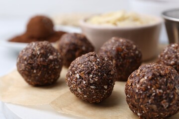 Making homemade candies. Chocolate balls and ingredients on table, closeup