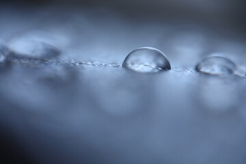 Blue water drops, minimalistic background, macro photography