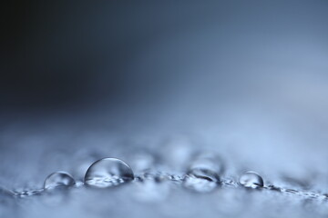 Blue water drops, minimalistic background, macro photography 