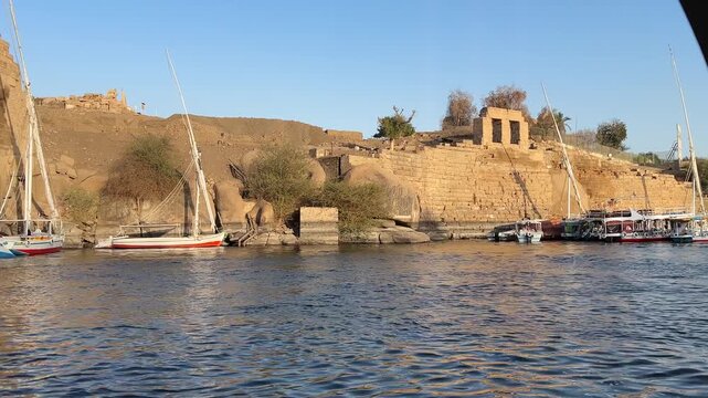 Boat ride to Temple of Isis, relocated from Philae to Agilkia Island, Aswan, Egypt, with scenic Nile River views.