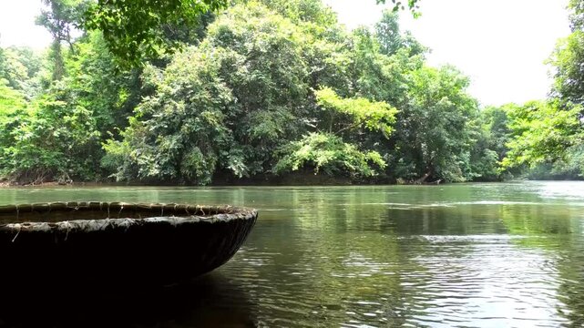A coracle boat moored on the banks of Kallar river at Adavi, Pathanamthitta, Kerala, India | Adavi Eco Tourism entertainments