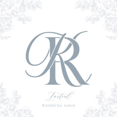 Elegant monogram wedding logo design in blue tones with floral accents, conveying sophistication and style. The monogram features intertwined initials K and R with a refined typography style.