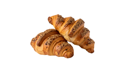 Two multigrain croissants topped with linseeds on a wooden surface. Isolated against a white background.