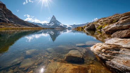 Majestic Mountain Peak Reflected in Calm Lake: A breathtaking vista unfolds as the towering mountain peak, capped with glistening snow, casts a perfect reflection in the tranquil lake.