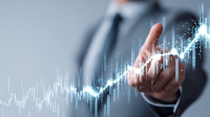 Businessman pointing at digital financial charts with upward trend, modern business growth and investment strategy on isolated white background, copy space.