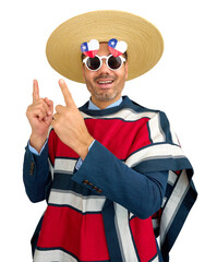 Studio portrait of businessman wearing traditional chilean huaso clothing pointing upwards with...
