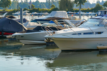 Boating activities at a serene marina during a sunny afternoon in a picturesque waterfront location